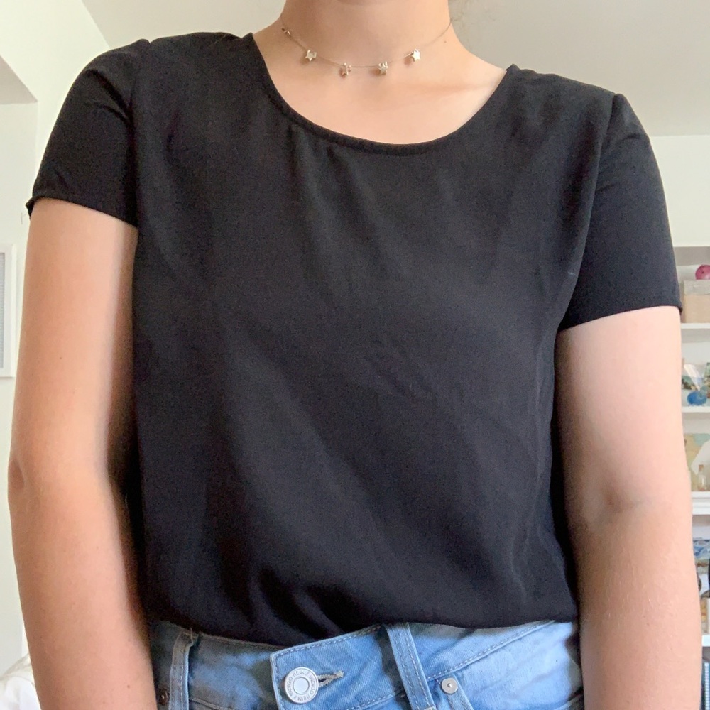 Black short sleeve dressy top.